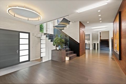 682 Hammond Street is not just a home, it's a statement! Located in one of the most prestigious zip codes in the Boston area, this contemporary property underwent a magnificent three year renovation as the sellers collaborated with the best of the be...