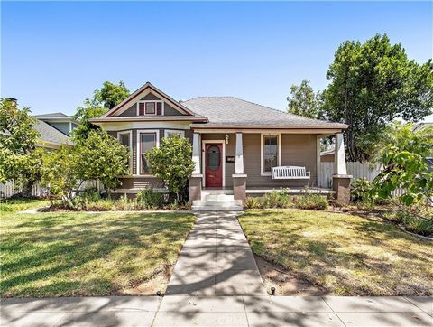 Historic one-story blend of Victorian and Craftsman bungalow with architectural elements to include a hipped roof intersected by a decorative gable that faces the street, two concrete pilasters with pedestals and tapered posts flank the steps leading...