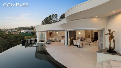 Sweeping North Shore ocean views and inspiring elegance are found in this BRAND NEW CONSTRUCTION in the La Jolla Hills. The curvilinear design and seamless flow to an expansive 2,355 SF. of exterior spaces help establish the home’s serene beauty. Wit...