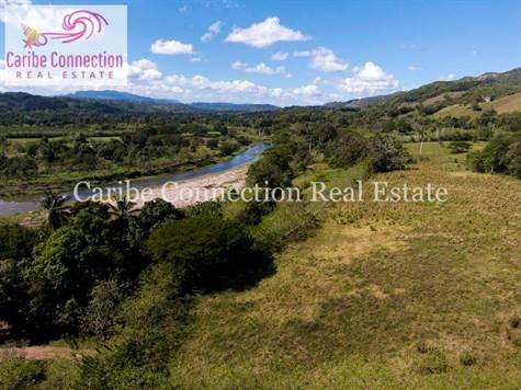 Escape to the idyllic surrounds of this large riverside flat land of 29.77 acres. The possibilities are endless with this plot of land that reaches the beautiful river of Jamao, famous for its calm turquoise waters and its river-tubing.  Located only...