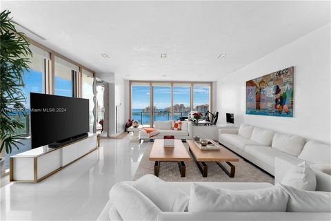 Crafted by the acclaimed designer Luis Bustamante, this turnkey residence at the prestigious Apogee presents a sophisticated living experience with sweeping views of the ocean, Fisher Island, and the city skyline. As you enter, you'll discover a spac...