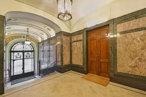 This imperial and extremely luxurious 200 m² flat is located in the heart of the embassy district on the belle etage floor of a stately home. Step into the wooden paneled entrance area and catch a first glimpse into the rooms. In the living room with...