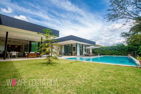 ID# 116990. Modern House for Sale in Santa Ana, Valle del Sol condominium. 940 sqm construction, 1780 sqm land, 4 bedrooms, 5.5 bathrooms, US$2.900.000. Welcome to the epitome of luxury and modernity in this stunning single-level residence in the dis...