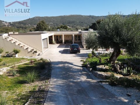 Nestled amidst the serene beauty of rolling mountains and tranquil nature of 'Porto de Mos' lies this exquisite detached one-story villa, a paragon of modern architecture boasting an energy certification of A+. Occupying a generous plot of 1412sqm wi...