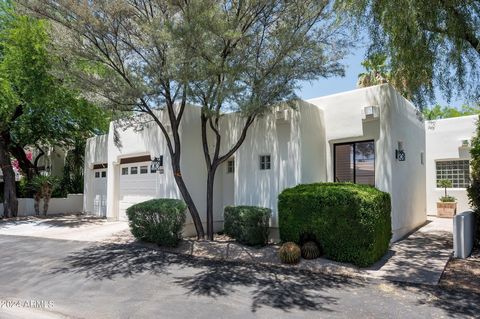 ''Yes Harriet, there is a garage in historic Casa Blanca!'' #324 is a beautiful single-level home with, 2 BR (split plan), 3 BA, and study. Relax in the wrap-around private garden patio with retractable awning and outdoor fireplace, designed by Charl...