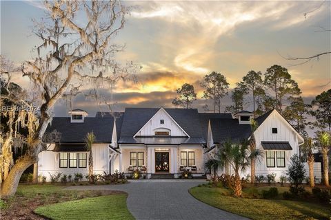 Introducing the Riverrun at Berkeley Hall, a stunning Modern Farmhouse crafted by the award-winning AR Homes, situated on a trophy deep-water homesite with a private dock on the Okatie River. A vaulted foyer adds to the open, airy feel of the Main Li...