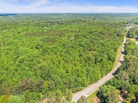 43.3 Acres in prestigious city of Milton/Alpharetta. One of the last tracts of its size in Milton. Wooded acres with spectacular hardwood trees in area of multi million dollar estate homes. Land is gentle rolling. Acreage ascend on Thompson Road. Bui...