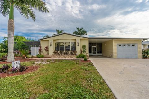 Seller is Actively Seeking Offers! This fresh updated house has it all...2BR + den/2BA, heated pool & spa with screened pool cage, Double lot, updated w/garage & carport, including a patio on water side, FL room with Crafter Corner & workshop for the...