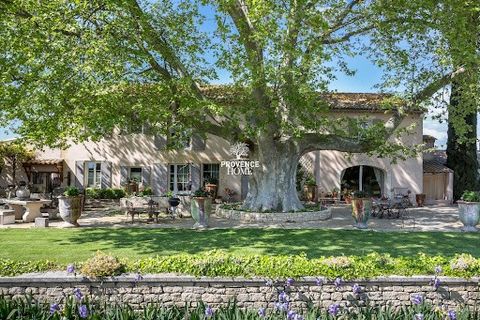 Provence Home, the Luberon real estate agency, is offering for sale, a magnificent property with a majestic entrance through a tall wrought-iron gate supported by stone pillars, opening onto a driveway lined with olive trees leading to the stone buil...