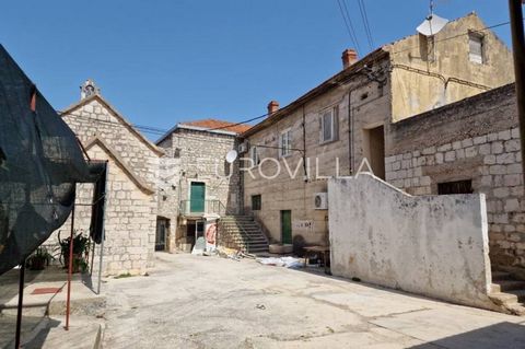 In an attractive location - in the very center of a small town near Trogir, an entire complex of buildings suitable for tourist purposes is for sale. The subject of sale are office spaces on the first floor, commercial spaces on the ground floor, and...