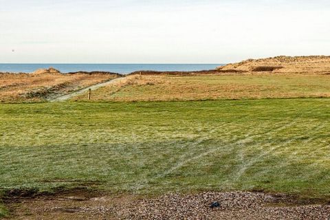 Holiday cottage in 1st row directly overlooking the North Sea. There is energy-saving air condition/heat pump. From the partly covered terrace with garden furniture you can enjoy the sunset while having dinner. The house has bright and practical furn...