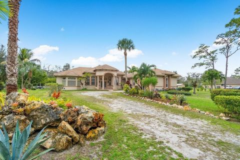 Introducing 81st Lane: A meticulously crafted four-bedroom, three-bath haven nestled on over an acre of lush serenity. This well-built retreat boasts a timeless barrel-tile roof, has over 10 fruit trees dotting the landscape and a backyard that is wa...