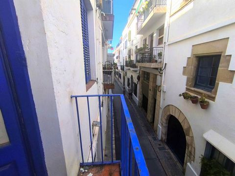 Mediterranean Charm | Apartment with Patio-Terrace in Historic Building of Sitges, close to the beach. Unique property in a romantic building with only 3 neighbors, located in one of the most emblematic streets of Sitges' old town, just 50 meters fro...