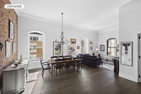 Introducing Residence 5B at 140 Nassau - a gorgeous loft space that artfully combines historic charm with contemporary living. Bathed in natural light, this sanctuary offers a flexible layout. The apartment entryway opens to the expansive living spac...