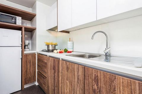 Spacious holiday complex directly on the gently sloping, beautiful pebble beach with modern and high-quality mobile homes. Depending on the location of the mobile home, it is only 20 to 200 meters to the beach, where two sun loungers are available pe...