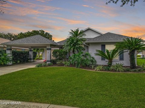 Step into luxury with this captivating three-bedroom, two-bath lakefront residence nestled in the highly sought-after Town Park subdivision of Port Orange, Florida. Crafted by Johnson Builders, this immaculate home boasts a thoughtfully designed spli...