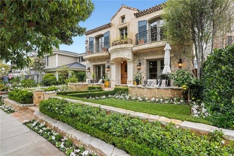 Experience coastal opulence at its finest with this breathtaking seaside sanctuary nestled in the heart of Corona del Mar Village. Mere steps from the ocean, this Provence-inspired architectural marvel offers a fusion of timeless allure and contempor...