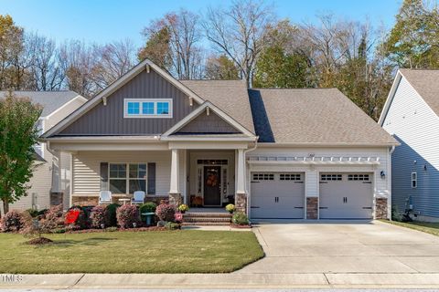 Craftsman style ranch with upgrades and finer details are the highlights of this home. Complete with neutral and soothing color palette, engineered wood floors in the living spaces, and plush carpet in the bedrooms make this space functional, beautif...