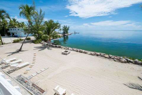 Welcome to a one-of-a-kind oceanfront estate located along the iconic Old Highway in Islamorada a rare offering with 200 feet of oceanfront shoreline, a private jetty with dockage, and breathtaking panoramic views of the Atlantic Ocean. This elegant ...
