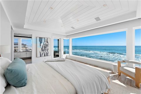 Set on the sand in the exclusive Capistrano Shores community, this rare double homesite offers ultimate California beachfront living, with panoramic whitewater, sunset, coastline, and beach views that stretch from the San Clemente Pier through the He...