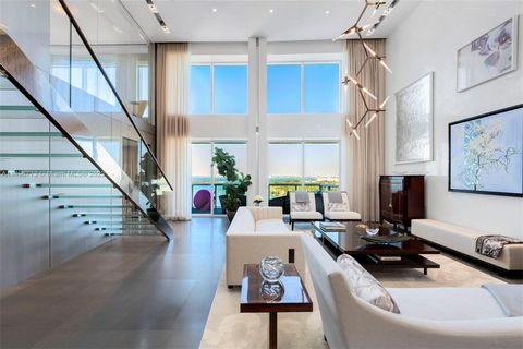 No expense was spared in this one-of-a kind 2 story home in the sky. Enjoy panoramic views of Biscayne Bay, downtown Miami & the ocean from this exquisitely designed & meticulously combined double PH. This 6BR/6BA 6,422sf masterpiece boasts top of th...
