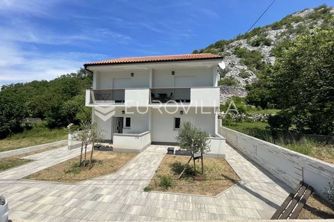 Senj, Lukovo, beautiful house with four apartments, each with a separate entrance, living area 150 m2. It is divided into two floors (ground floor, first floor and attic). On the ground floor there are two apartments consisting of an open space livin...