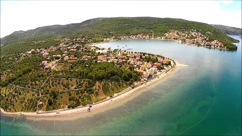 Building plot of 1 206 sqm is located in the vicinity of Šibenik, in a small fairy-tale place Bilice. It is sold for a price of 98 000 €. The land is constructive. The promenade is 20 m away and the distance from the sea is 50 m. It is possible to pa...