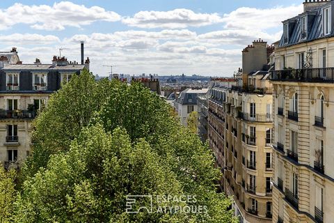 Located on the southern slope of the Montmartre hill, this very bright apartment of 63.04 m2 Carrez occupies the entire top floor of a building with a pretty Montmartre building. As soon as you enter, you will discover a beautiful living room with vi...