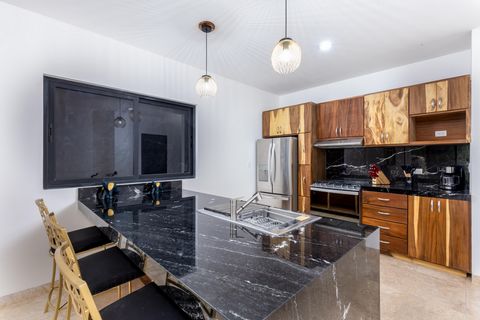 Welcome to ITZAMATUL a small condo development featuring 6 premium units each crafted with high quality finishes such as parota wood and granite countertops. The property offers spacious interiors private terraces and a shared rooftop with breathtaki...