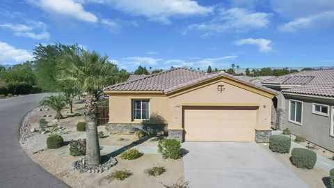 Looking for a desert retreat to call your own or a low maintenance country club vacation rental that allows short term rentals? This open and airy 3 bedroom three bath home on FEE land (no leased land at this property) offers both options! With a new...