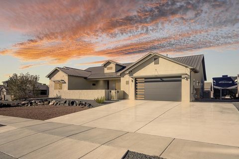 Nestled in the desirable Petroglyph Estates, this 2020 Parade of Homes Winner offers an exceptional blend of nature and luxury. With access to scenic walking and bike trails along the escarpment, and Boca Negra Canyon, outdoor activities are plentifu...