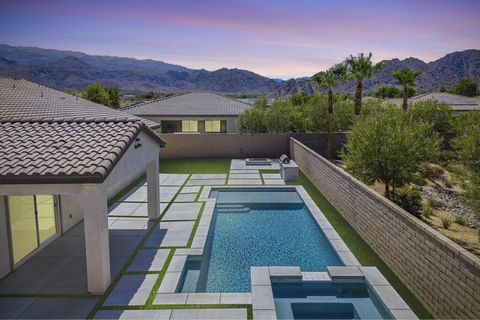 Desert luxury hits a high note at 58229 Coral View Way—an architectural showpiece and the crown jewel of Cantera at Coral Mountain. Set on one of the community's largest lots, this rare 4-bedroom, 3-bath single-story stunner sprawls across 3,114 squa...