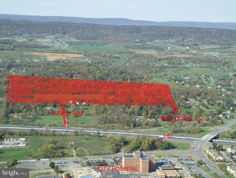 53+- acres +/- set back and entirely visible from I-81. Site is situated off of Exit 14, I-81 interchange; University of WV Hospital Exit and Dry Run Road Exit. It is across I-81 from the University of WV hospital. Current access is via Shellbark Lan...