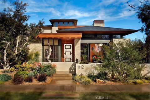 A spectacular Mid-Century inspired home set upon an ultra rare 11,000 sq ft lot in the idyllic Lake Park District of Huntington Beach. This modern Prairie Style inspired architectural award-winning home, hosts 6 bedrooms and 8 bathrooms in an expansi...