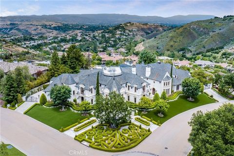 ***SELLER MAY CARRY A NEW FIRST LOAN AT 5.5% INTEREST FOR 2 YEARS, FOR A QUALIFIED BUYER. The terms are negotiable. Easily one of the most exquisite properties in all of Calabasas, this architectural masterpiece of French influence and design is nest...