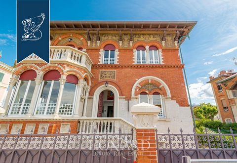 On the renowned Versilian coast, there is this stunning luxury villa for sale in an exclusive seafront position in Massa-Carrara, which can be admired from its panoramic terraces. This Art Nouveau property offers a beautiful 320-sqm private garden. T...