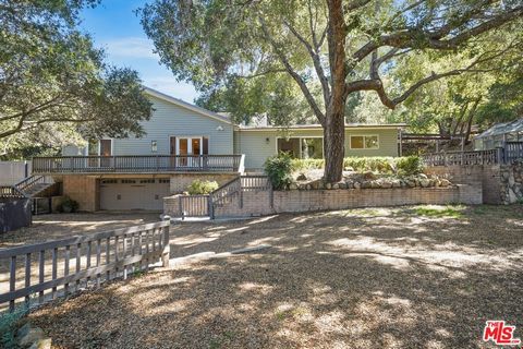 Nestled within the enchanting enclave of Monte Nido, this captivating single-family home beckons with its unique blend of charm and tranquility. Offering four bedrooms and three bathrooms, this spacious abode is set upon approximately .64 acres of pi...
