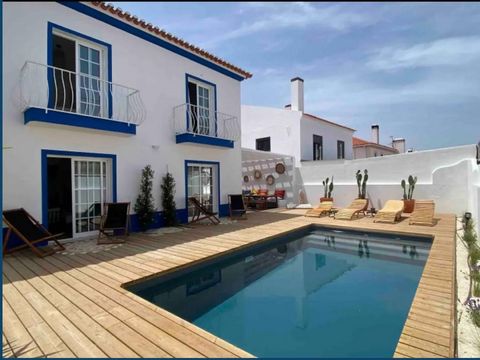 In the heart of Comporta Village, villa of traditional architecture fully renovated in 2021. 4 bedroom villa with 200m² sold fully furnished, terrace deck, garden, heated pool, inserted in a plot of 388 m2. On the ground floor, there is a large livin...