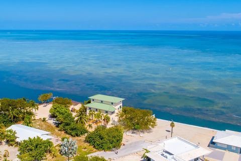 3 Story custom concrete home Directly overlooking the Atlantic. Southern Exposure with sunsets, Views, Turquoise water, and everything you come to the Keys for. Boating, pool, dockage, Kayaking, Paddleboarding, bicycling, You can do it all from this ...